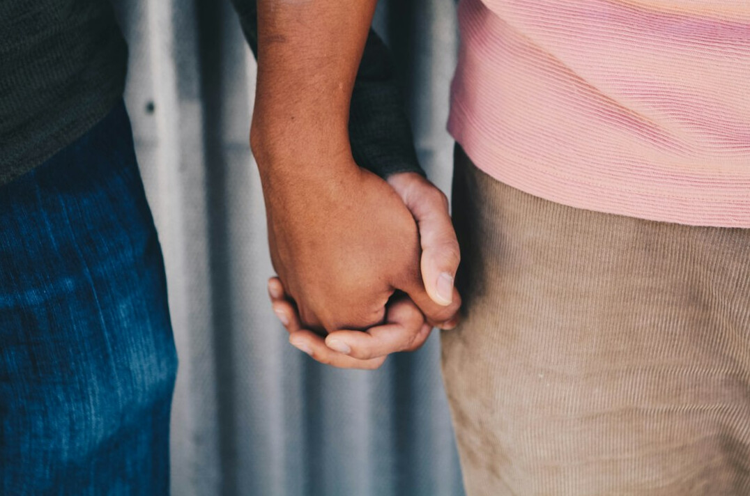 Two business people shaking hands after a partnership meeting
